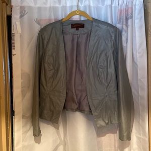 A grey leather jacket with stretchy material on arms and back